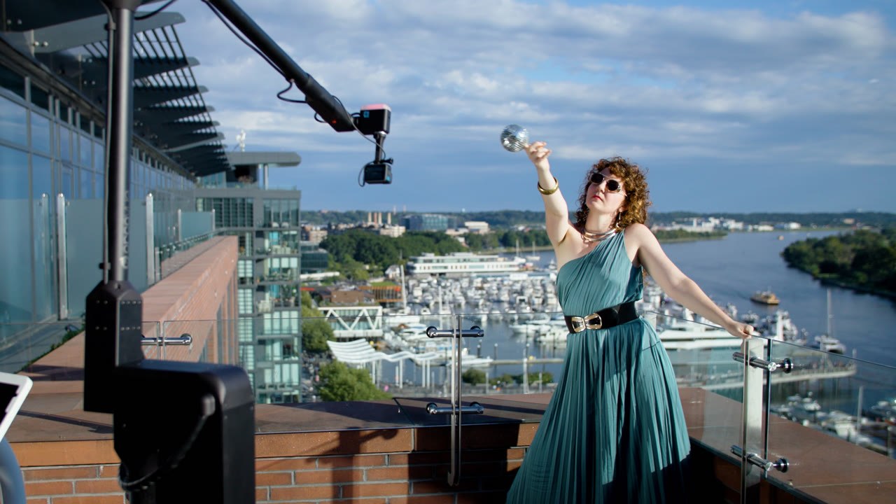 Guest posing for a Viewso Glambot on a rooftop